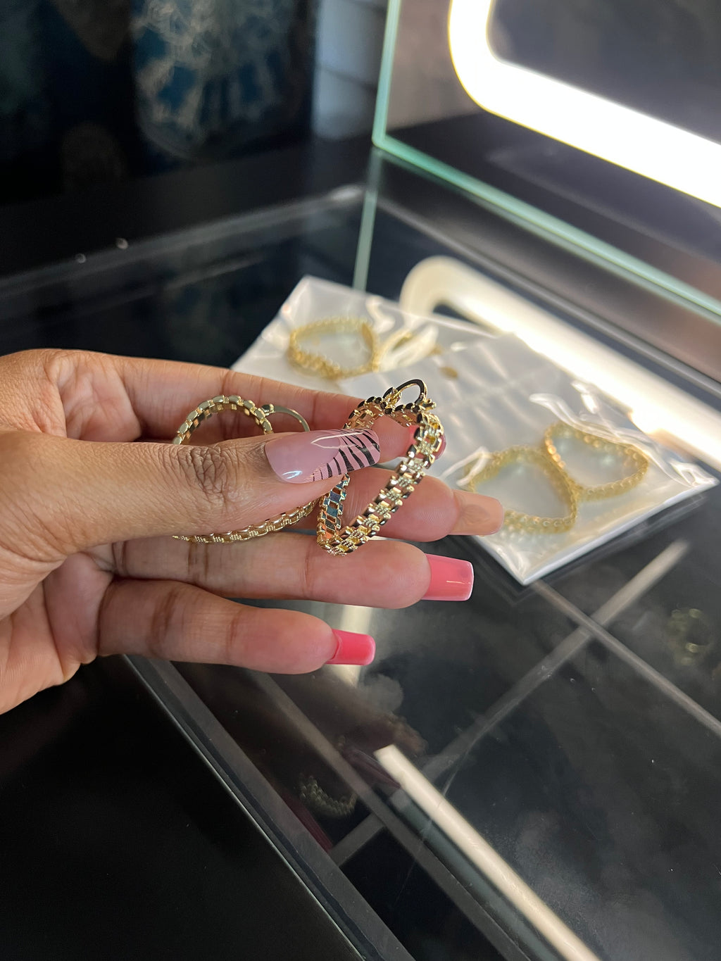 Small Rolex hoop earrings