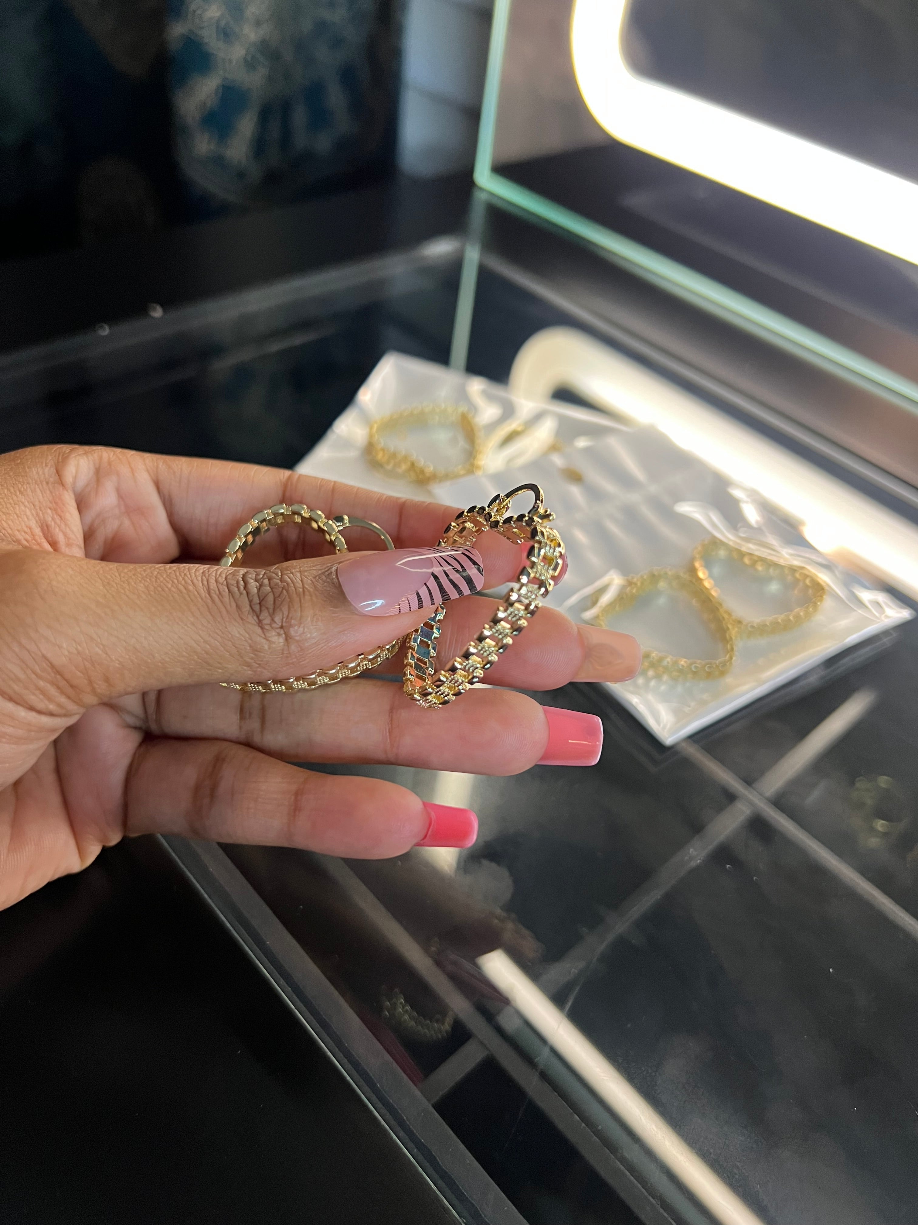 Small Rolex hoop earrings